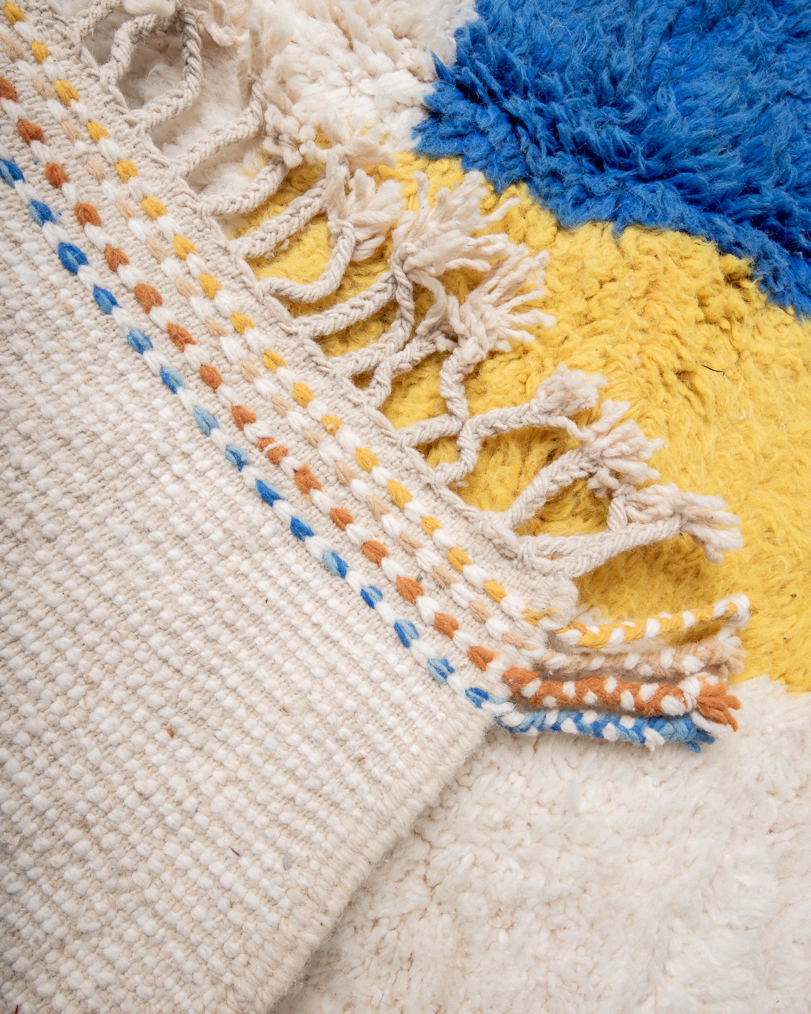 Modern, designer, handcrafted Berber rug from Morocco. Beniourain carpet with beautiful colours and patterns and fluffy wool texture.